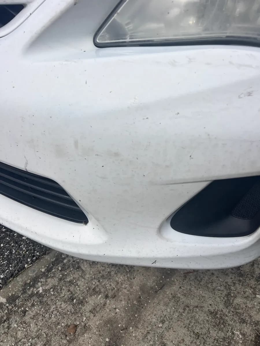 Front bumper closeup — before