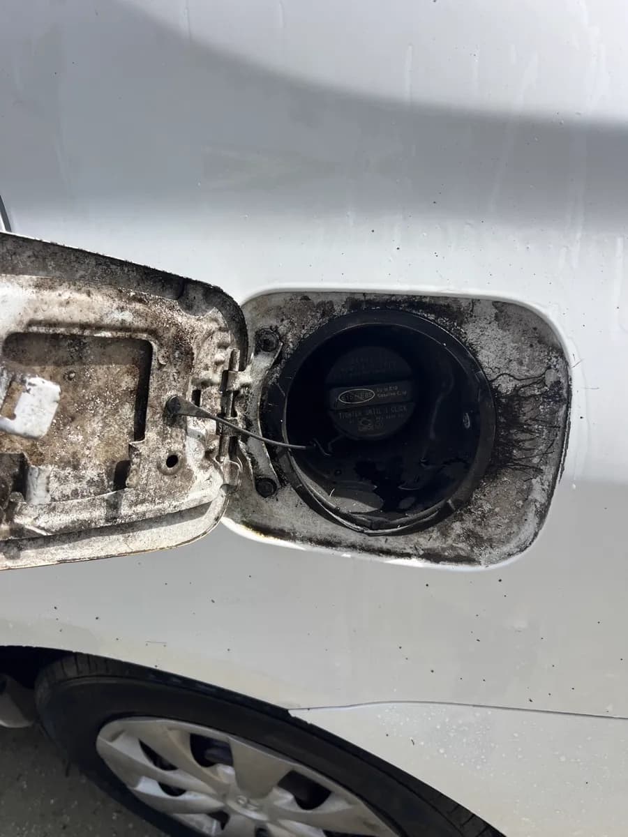 Gas cap area grime — before